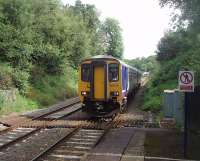 A Clitheroe to Manchester service, formed by 156472, slows to a halt in the very short platform at Ramsgreave and Wilpshire. Behind the train the original Wilpshire station, closed in 1962, can be glimpsed. [See image 19868].<br><br>[Mark Bartlett 23/07/2011]