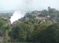Stanier 8F 2-8-0 48151 gets to grips with the steep climb out of Lancaster with a <I>Fellsman</I> charter to Carlisle via Preston and the S&C. ON this clear still morning I'm sure the bark of the locomotive's exhaust could be heard all over the city. <br><br>[Mark Bartlett 17/08/2011]