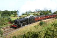 LMS Stanier 8F no 48151 hauls <i>The Fellsman</i> railtour on 17 August 2011 as it approaches Coote Lane road bridge on the climb from the WCML between Farington Curve Junction and Lostock Hall. <br><br>[John McIntyre 17/08/2011]