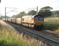 66098 heads the thrice weekly 6V71 Hardendale (Shap) to Margam lime train south along the WCML at Woodacre on a sunny evening in July 2011. <br><br>[Mark Bartlett 27/07/2011]