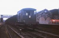 The tail end of a northbound Sunday track-lifting train at St Boswells in the Spring of 1971. The dismantling of the Waverley Route was a painfully protracted start-stop affair, beginning (witnessed by the press) with the part-symbolic lifting of a track panel at Riddings on Wednesday 8th January 1969 [see image 23226] and concluding on an unknown date in Autumn 1972 at Lady Victoria Colliery.<br><br>[David Spaven //1972]