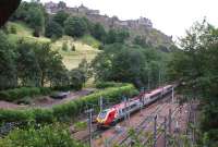 A Virgin Voyager heads west through Princes Street Gardens with an <br>
Edinburgh to Birmingham service on 19 August 2011 with Edinburgh Castle on the skyline.<br><br>[John McIntyre 19/08/2011]