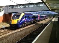 A Kings Cross - Hull express service speeding north through Peterborough station on 11 August 2011, formed by First Hull Trains unit 180111.<br><br>[Ken Strachan 11/08/2011]