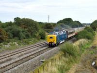 Deltic 55022 <I>'Royal Scots Grey'</I> at speed on the Great Western Main Line  with a GB Railfreight staff outing from Peterborough to Weston super Mare on 20 August 2011. The special is passing the site of the long gone Shrivenham Station on the east side of Swindon.<br><br>[Peter Todd 20/08/2011]