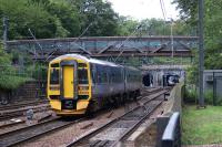 158869 heads east towards its final destination at Edinburgh <br>
Waverley on 19 August 2011. Part of the station can be seen through the middle double track bore of The Mound tunnel.<br>
<br><br>[John Mcintyre 19/08/2011]