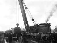 A hive of activity at Duns on a March afternoon in 1963.  Scene at the east end of the loop following a derailment involving B1 4-6-0 no 61116, which occurred while the locomotive was running round the daily freight from Tweedmouth. The Tweedmouth steam breakdown crane is in the process of re-railing the B1's tender. [See image 35373]<br><br>[Bill Jamieson /03/1963]