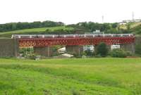 With the scaffolding having recently been removed [see image 3448], the refurbished and repainted Jamestown Viaduct is seen here looking its best on a pleasant June morning in 2006, as a 6-car commuter service crosses southbound heading for Edinburgh.<br><br>[John Furnevel 20/06/2006]