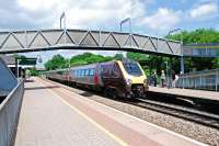 Located 7 miles east of the town of Tiverton, near the Junction of the M5 and the North Devon Link Road, is Tiverton Parkway station. The station opened on 12 May 1986, the day after closure of Tiverton Junction [see image 35388] and is built on the site of the former Sampford Peverell Halt [closed in October 1964]. A westbound service calls at the station in June 2010.<br><br>[Ewan Crawford 11/06/2010]