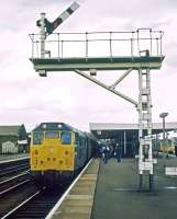 A Monday afternoon Kings Lynn to Liverpool Street service headed by 31 325 arrives at Ely's platform 2a on 27th March 1978.<br><br>[Mark Dufton 27/03/1978]