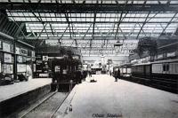 A postcard view looking to the buffers at Oban. A discussion seems to involve two deer which appear to be 'resting' on the platform. Demolition of this station and removal of the platforms seen here, leaving only the Ballachulish platforms today, was a huge loss. (Postcard in my collection, photographer unknown.)<br><br>[Ewan Crawford Collection //]