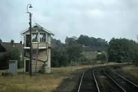 Beccles South signal box recorded from the front of an Ipswich-bound DMU on 4th August 1979. The box was abolished in February 1986 when Radio Electronic Token Block (RETB) signalling was introduced to the East Suffolk line. Beccles North box had closed at the start of the 1970s.<br><br>[Mark Dufton 04/08/1979]