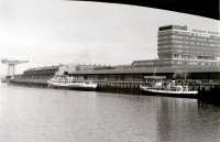 <I>Queen Mary II</I> at Stobcross in 1977, with her masts shortened to allow her  under the Kingston Bridge up to Bridge Wharf. Nearest the camera is MV <I>Queen of Scots</I>, chartered by the <I>Waverley</I> operators to cover for her during repair work following her contretemps with the Gantocks.<br><br>[Colin Miller //1977]