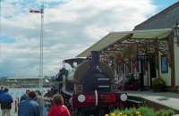 'Heart of Scotland' station was a fine mishmash, care of Central Regional Council, at the Glasgow Garden Festival in 1988. Rowrah and Kelton Fell locomotive No 13, an old BP wagon, the station building from Monifeith (now at Birkhill) [see image 16125] and the signal from ... no doubt someone knows. The view looks south east, the Princes Dock canting basin is seen to the left and the Govan graving docks are behind the camera.<br><br>[Ewan Crawford //1988]