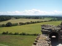 The formation of the Lossiemouth branch line as seen looking south east from the top floor of Spynie Palace, a Historic Scotland ruin on the outskirts of Elgin. Closed to passengers in 1964, the line ran more or less dead straight across the flat countryside between the two towns and the trackbed can be walked for most of its length. <br><br>[Mark Bartlett 02/07/2011]