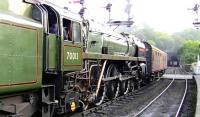 Britannia Pacific no 70013 <I>Oliver Cromwell</I> propels a support coach from Grosmont station over the level crossing towards the shed on 1 September 2009.<br><br>[Colin Miller 01/09/2009]