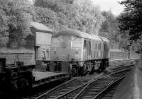 24104 heading east through Princes Street Gardens with a well wagon in 1976, presumably part of an engineers or MOD train.  <br><br>[Bill Roberton //1976]