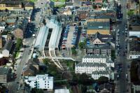 An aerial view west over Helensburgh Central station in the summer of 2011. The area to the right of the station once contained the carriage sidings, goods yard and engine shed [see image 22362]. There was a siding to the left for the gasworks.<br><br>[Ewan Crawford 29/08/2011]