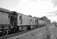 The Gateshead breakdown crane arriving at Duns in the early afternoon of 30 August 1965. It was propelled from Reston by BR Sulzer Type 2 no D5180 to get it as close as possible to the derailed D181 [see image 35405]. <br><br>[Bill Jamieson 30/08/1965]