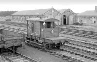 A long way from home... SR design brake van DS55990 at Ladybank in April 1978. The former wagon repair shop stands in the background [see image 16665].<br>
<br><br>[Bill Roberton /04/1978]