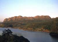 A glorious evening to be on the last Inverness - Kyle of Lochalsh service of the day. The train is seen here skirting the south shore of Loch Carron as it heads west near Duncraig on a summer evening in 1979.<br><br>[Frank Spaven Collection (Courtesy David Spaven) //1979]