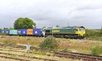 Freightliner 66518 brings a container train round the north to east curve between Oxford and Didcot on 11 August 2011.<br><br>[Peter Todd 11/08/2011]