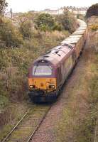 67007 passes the site of Meadowbank Stadium (1986-1988) with the 6B46 Oxwellmains - Powderhall empty 'Binliner' train on 6 September making its way back to Powderhall depot.<br>
<br><br>[Bill Roberton 06/09/2011]