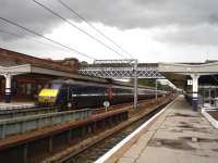 With rain clouds gathering overhead, DVT 82212 brings up the rear of a now rare all blue liveried East Coast Mk 4 working on 6 September 2011. The train is the 09.35 Kings Cross - Leeds, seen here leaving Wakefield Westgate.<br><br>[David Pesterfield 06/09/2011]