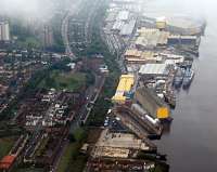 An aerial view with BAE's Scotstoun Yard to the right. To left of the yard was Scotstoun West station and above that the junction with the Rothesay Dock Branch. July 2011.<br><br>[Ewan Crawford 20/07/2011]