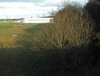 View north from the decrepit and disused roadbridge at Thorneybank looking north to the site of Dalkeith Colliery (to the left of the distant pylons). [See image 35558].<br><br>[Ewan Crawford 26/12/2004]