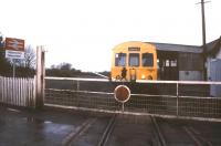 A Pembroke Dock - Swansea train calls at Manorbier, with its traincrew-operated level crossing, in May 1988.<br><br>[Ian Dinmore /05/1988]