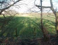 Some sections of the Whittingham Hospital Railway trackbed have reverted to farmland but the original boundary fence survives. This view is towards Grimsargh from the edge of the hospital site. [See image 35620] for the same location around 1950. Access by kind permission of NHS staff.<br><br>[Mark Bartlett 13/03/2011]