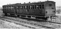 An ex LYR and an ex North London coach gently decay in a siding next to the running line at Whittingham Hospital. They were replaced around 1946 by three converted ex LNWR brake vans and mouldered in this siding for many years. They can be seen in the background in image 35480. [See image 35617] for the same location in 2011.<br><br>[David Hindle Collection //1952]