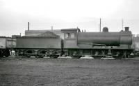 Class J27 0-6-0 no 65863 stands in the shed yard at North Blyth. Thought to have been taken in 1958/59 looking landward, with the top of the 52F coaling stage visible in the background. <br><br>[K A Gray //]