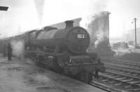 A murky and misty December day at Carlisle station in 1961. Jubilee no 45717 <I>'Dauntless'</I> off Bank Hall shed is standing at platform 1 with the 9.43am Liverpool - Glasgow Central.<br><br>[K A Gray 22/12/1961]