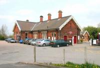 The 1876 main building on the down platform at Appleby. Photographed on a Saturday afternoon in May 2006 looking north east across the station car park.<br><br>[John Furnevel 06/05/2006]