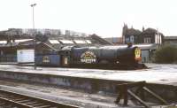 Ex-GWR King class locomotive no 6023 <I>King Edward II</I>, stabled in 'rescued' condition at Bristol Temple Meads station in May 1985. The banner proclaims that the locomotive is to be restored with the help of a Bristol based company renowned for its sherry.<br>
<br><br>[John McIntyre /05/1985]