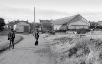 The 1859 terminus at Portsoy, replaced 25 years later by a new through station when the line was extended west. Seen here in September 1977, the old train shed still survives alongside Seafield Place.   <br>
<br><br>[Bill Roberton /09/1977]