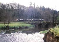 A DMU on the Barnstaple line in the summer of 1989. The train is passing Homeland Bridge over the River Taw, east of Eggesford. [With thanks to David Greig, George McNeill, Vic Smith & Colin Armit]<br><br>[Ian Dinmore /06/1989]