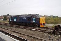 DRS EE Type 3 37261 stabled in a siding alongside Platform 11 at York in October 2008. Shortly afterwards this particular Class 37 was put into store. It has since spent time at various locations including Carnforth [See image 30687]. The area in the background is now occupied by the Network Rail Operating Centre but the sidings are still used to stable DRS locos.<br><br>[Mark Bartlett 12/10/2008]
