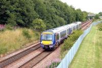 A Falkirk Grahamston - Glasgow Queen Street service slows for the Greenfaulds stop on 26 July 2006. Greenfaulds station, on the south side of Cumbernauld, opened in 1989 [see image 12429].<br><br>[John Furnevel 26/07/2011]