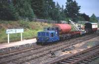 A PW train departs from Boat of Garten in August 1975 to carry out some re-sleepering work towards Aviemore. The loco is the ex Aberdeen Gas Board Simplex 4w DM shunter No 1D, at that time still in Gas Board blue livery. <br>
<br><br>[John McIntyre /08/1975]