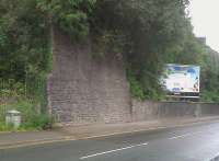 Every abutment tells a story. Just North-West of the current Risca station on the Ebbw Vale line is one end of the former Risca Long Bridge. It was originally built as part of a tramway, but later replaced by an embankment around 1905 to allow easement of curves. I was told by a local resident that the demolition contractor was paid one pound per arch - that is 32 - to demolish the bridge; but was allowed to keep the stone, which he used to build a terrace of houses nearby. Sadly, he paid for this deal with the loss of one eye in an accident during the demolition. Notice the number of drains in the abutment - I counted eight!<br><br>[Ken Strachan 13/08/2011]