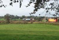 A DRS Class 66 heads a down WCML container through the Lancashire countryside on 21 September. The train has just passed through the closed station at Bay Horse between Lancaster and Preston. <br><br>[Mark Bartlett 21/09/2011]