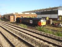 Passing shot showing class 50 <I>Royal Oak</I> in Loadhaul livery and numbered as 50135 stabled at the west end of the Pullman Rail maintenance facility in the former fuelling shed alongside Cardiff Canton Depot on 14 September. <br><br>[David Pesterfield 14/09/2011]