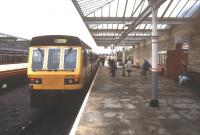 Pre-electric days at Ilkley in October 1990 with a train for Skegness at the platform.<br><br>[Ian Dinmore /10/1990]