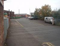 The now disused level crossing at Deepdale Mill Street in Preston looking north west. The lines in the foreground originally went to the terminus of the Preston and Longridge Railway that later became a goods yard and then the Coal Concentration Depot. Just beyond the bend in the road a bridge can be seen. This crosses the <I>mothballed</I> link line that runs from Deepdale Junction to the WCML just north of Preston station.<br><br>[Mark Bartlett 22/09/2011]