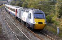 The 09.00 Newcastle - Edinburgh via Carlisle shuttle nears Curriehill on 25 September led by 43306 but with East Coast branded former Midland Mainline (?) stock.<br>
<br><br>[Bill Roberton 25/09/2011]