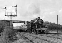 After leaving York on 2 May 1981, ex-S&DJR 7F No. 13809 heads south through Moorthorpe to Sheffield, where it will hand over the <I>Pines Express</I> excursion to 'Peak' No. 45 075 for the return to Leicester. Moorthorpe still boasted a nice collection of semaphore signals at that time, the arm on the extreme left giving access off the Swinton and Knottingley Joint line, which the special has traversed from Ferrybridge, onto the ex GNR Doncaster to Leeds line.<br><br>[Bill Jamieson 02/05/1981]