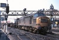 No 6843 stands at Waverley on a fine summer's day in June 1970 with the 09.38 Esso block working from Bowling to Granton. The train is waiting for the road along to Abbeyhill Junction where it will turn north towards its destination. In the right background a Deltic can be seen at the head of the 12.00 departure for Kings Cross.<br><br>[Bill Jamieson 19/06/1970]