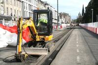 Neatly excavated sections of road ready for replacement alongside the yet to be used tram lines on Princes Street. Photographed looking east around lunchtime on 27 September 2011.<br><br>[John Furnevel 27/09/2011]